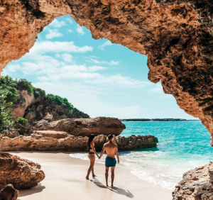 Natural rock formations surround a secluded beach